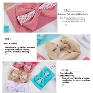 Close-up of baby headband featuring polyester bubble fabric texture and lace bow detail