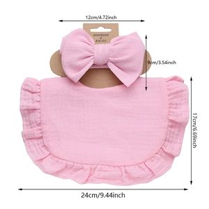 Pink cotton baby bib and headband set with ruffled edges and large decorative bow
