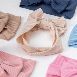 Set of six colorful ribbed knit baby headbands with large elastic bow hair accessories