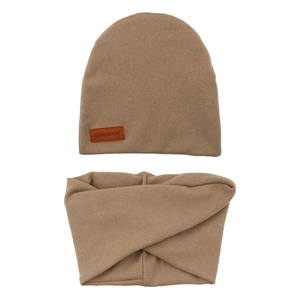 Detail of baby knit hat and scarf set with brown leather Hand Made label accent