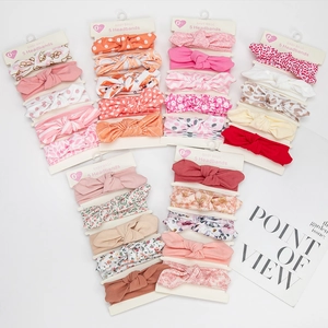 5-piece baby bow headband set with cute floral and polka dot patterns for newborns