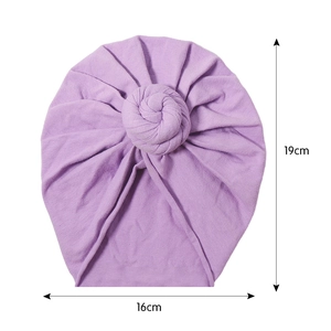 Solid purple knit cotton baby turban hat with a stylish donut knot and stretch fabric