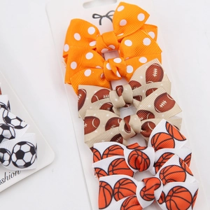 Fünfteiliges Set aus Ripsband-Haarschleifen mit Sportmotiven wie Football und Basketball
