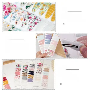 Detail view of 10pcs floral cotton hair clips with black metal snap fasteners