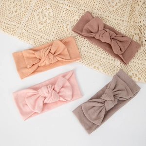 Breathable organic cotton bow headbands for babies in soft earthy pastel colors