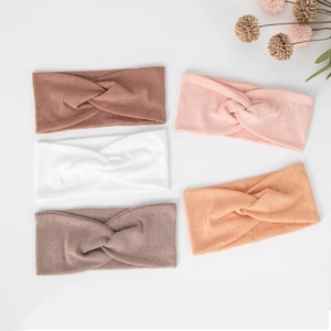 Detail view of five-piece set elastic yoga headbands with cross knot design and soft texture