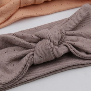 Detail of organic cotton baby headbands with bow knot and breathable knit texture