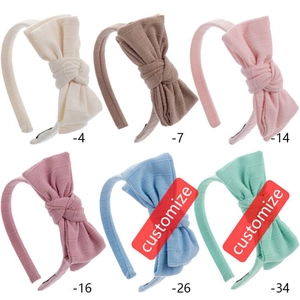 Striped cotton bow headbands for girls in various soft colors with ribbed texture fabric