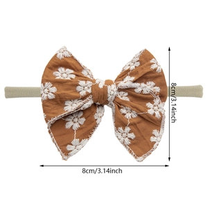 Caramel cotton baby headband with white daisy embroidery and elastic nylon band