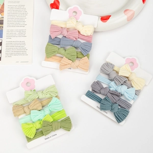 Detail of high-elastic nylon baby headbands with knitted bow ties in macaron colors