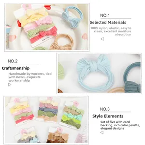Detail of 5-pack nylon baby bow headbands with high elasticity on display cards