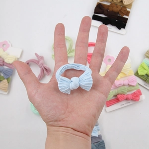 Macro shot of high-elastic soft ribbed baby bow headbands in multiple pastel colors