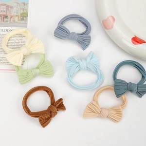 Seven-piece minimalist bow hair tie set in pastel colors with elastic nylon fabric