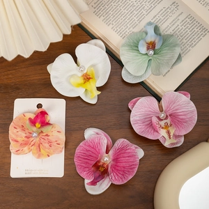 Phalaenopsis orchid hair clips set with pearls for beach vacation and elegant hair styling
