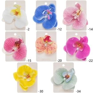 Phalaenopsis orchid hair clips with center pearl in eight colors on display cards