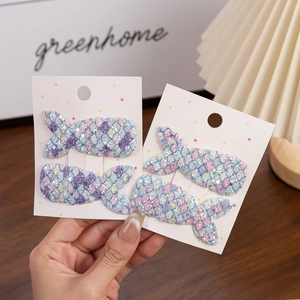 Sparkly mermaid tail hair clips for girls featuring colorful sequins in pastel gradient tones
