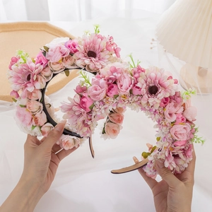 Detail of pink and white silk daisy flower headband for ethnic floral hair styling