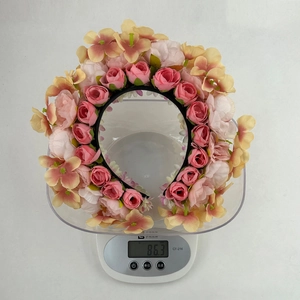 Floral hair wreath headband with pink roses and forest style design weighing 86.3g