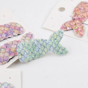 Detail of sequin mermaid tail hair clips with macaron scale texture for girls