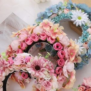 Detailed top view of pink and blue floral headbands with realistic silk flowers