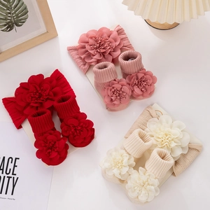 Close-up of baby floral headband and sock set with handmade 3D fabric flowers