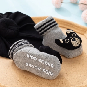 Grey cotton baby socks and hat set featuring a 3D French bulldog doll with non-slip grip