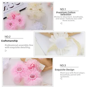 Close-up of baby socks and headband set with multi-layer lace flowers and soft cotton texture