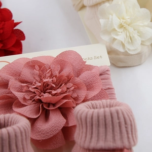 Detail of baby chiffon flower headband and ribbed cotton socks set in three colors