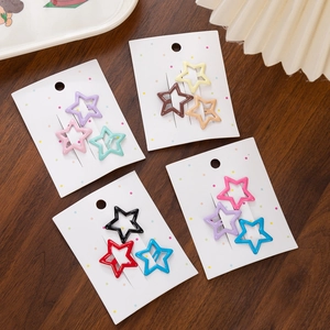 Star shaped metal hair clips in macaron colors displayed on cards for little girls