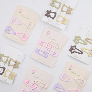 Detailed close-up of colorful Morandi star hair clips set on elegant display cards
