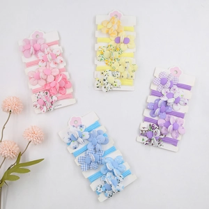 Détail de l'ensemble d'élastiques à cheveux à fleurs et carreaux pour enfants