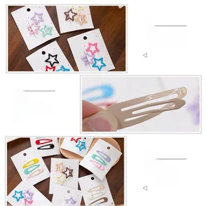 Close-up of colorful metal star and teardrop hair clips set for young girls