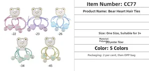 Detail showing colorful heart pendants and elastic hair bands for children in five macaron shades