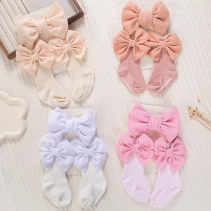 Ensemble détaillé de bandeaux et chaussettes à nœud pour bébé en couleurs pastel