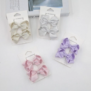 Set of four pairs of elegant satin bow hair clips in champagne, grey, lilac, and pink