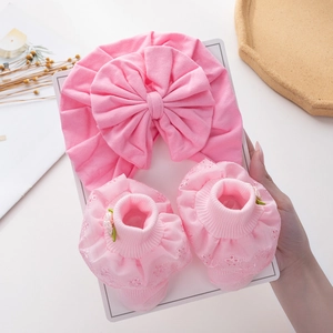 Pink newborn cotton turban hat and lace trim socks set with large decorative bows