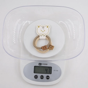 Minimalist elastic hair ties for kids 2-piece set shown on scale weighing 4.7g