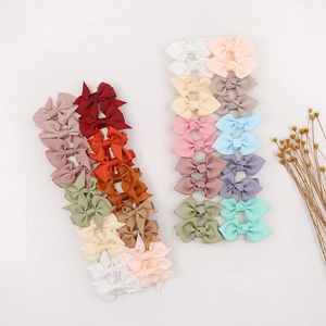 Detailed set of multi-color grosgrain ribbon bow hair clips on display card