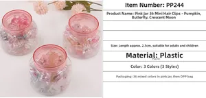 Detailed view of 36 colorful mini plastic hair clips in a portable pink storage jar