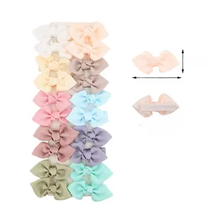 Detail showing colorful grosgrain ribbon hair bows with fully lined metal alligator clips