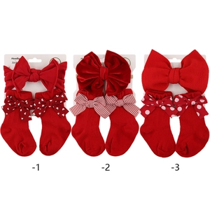 Red festive baby headband and sock gift set with bows for newborn holiday outfits
