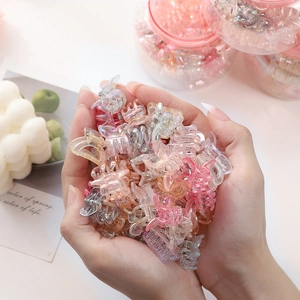 Macro view of mini butterfly hair clips with iridescent colorful translucent finish