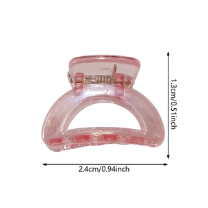 Detailed size view of a pink glitter mini hair claw clip measuring 2.4cm by 1.3cm