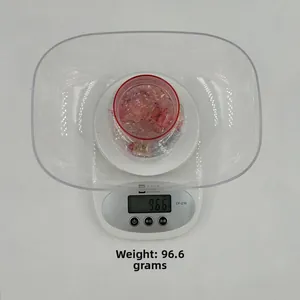 Digital kitchen scale with transparent bowl showing weight 96.6g and LCD display detail