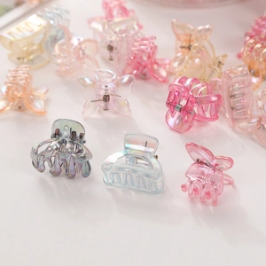 Close-up of mini colorful butterfly hair clips with shimmering translucent finish
