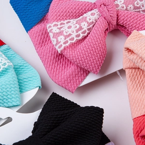 Détails de bandeaux colorés pour bébé avec nœuds et texture en tissu gaufré doux