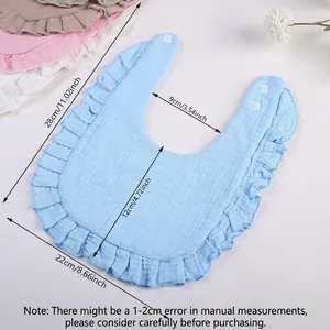 Soft cotton baby bib with ruffle edges and snap buttons, blue color shown with size chart