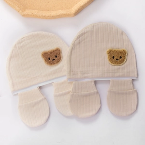 Organic cotton baby bear hat and mittens set in cream white with soft ribbed texture