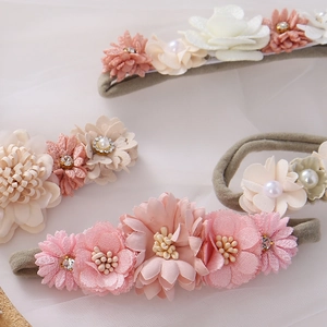Detail of floral infant headbands with chiffon flowers and soft elastic fabric straps