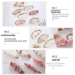 Detailed view of handmade fabric flower headbands with nylon bands and faux pearls